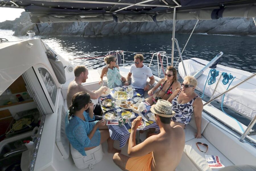 Santorini: Private Catamaran Cruise with Food & Drinks - The lighthouse, Indian Rock, and Aspronisi