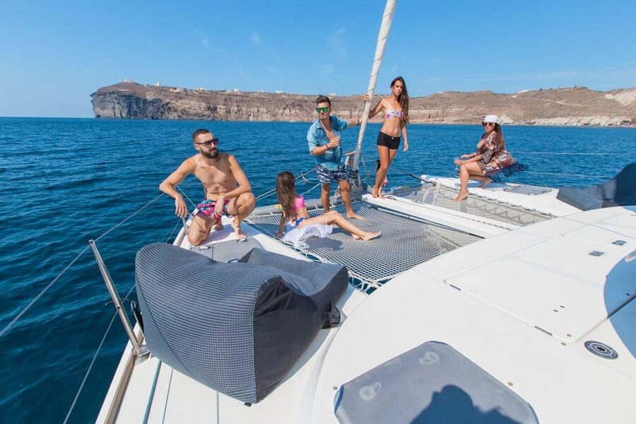 Santorini: Private Catamaran Cruise with Food & Drinks - Mésa Pigádia is the main swim and meal stop