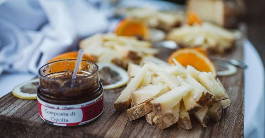 Siena: Food and Wine Walking Tour - Cheese, cured meats, and olive oil on the table