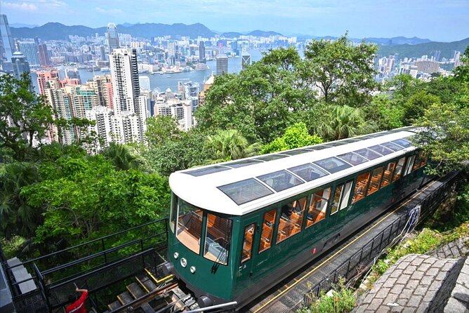 Top-Rated Hong Kong Tour: Peak Tram, Dim Sum & Cultural Sights - Riding the Peak Tram above Central