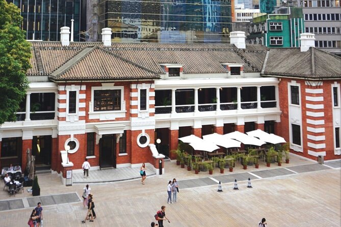 Top-Rated Hong Kong Tour: Peak Tram, Dim Sum & Cultural Sights - Returning by tram and entering Old Town Central