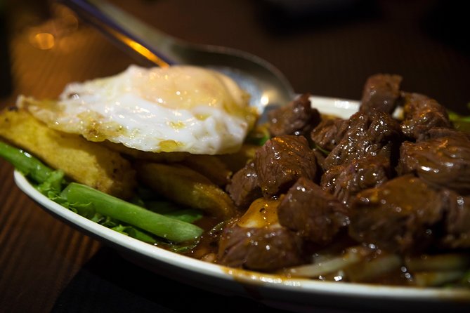 Ultimate Phnom Penh Food Tour by Tuk Tuk: 20 Tastings and Drinks - Independence Monument: roadside sweets